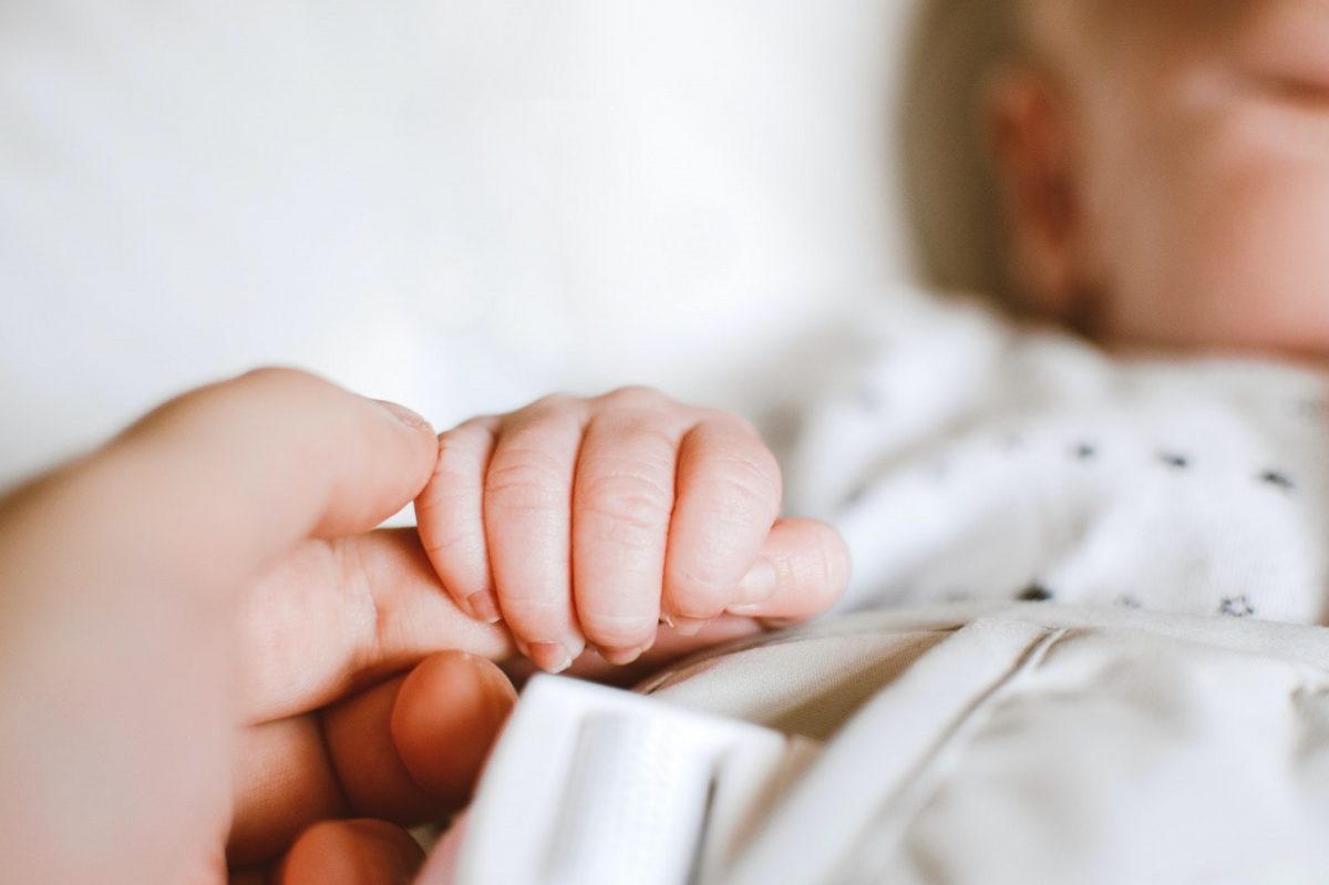 person-holding-baby-s-hand-2721581-1200x799.jpg